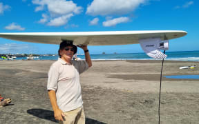 Allen Pidwell with his motorized surfboard.