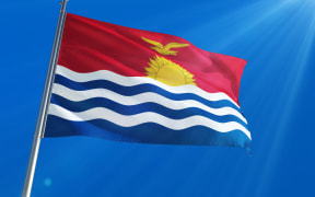 Kiribati National Flag Waving on pole against deep blue sky background. High Definition