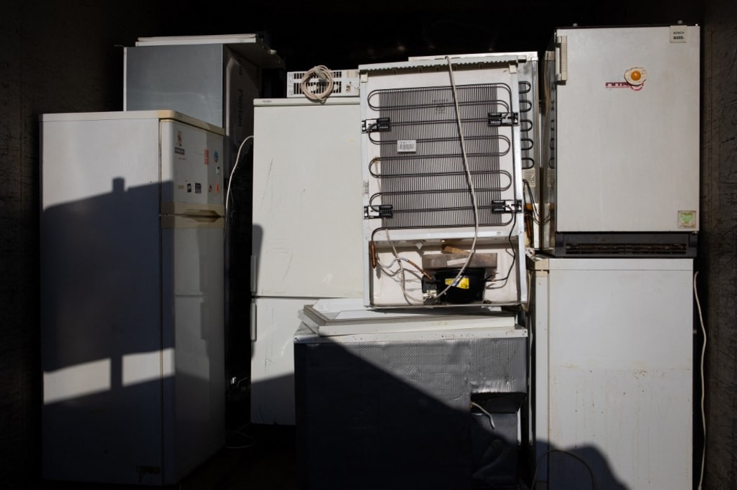 04 November 2020, Hamburg: Old refrigerators and freezers are collected in a container at the St. Pauli recycling centre. Due to the Corona pandemic, the Hamburg city cleaning service has called for the recycling yards to be used only for urgent deliveries.