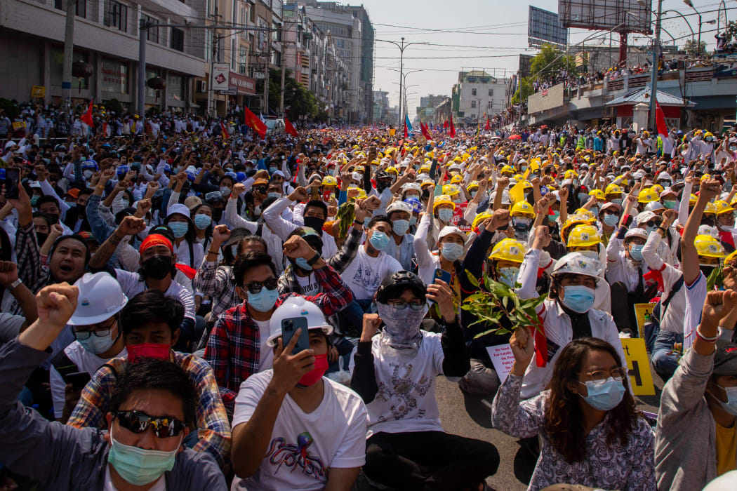 Protesters take part in a demonstration against the military coup in Mandalay, 22 February 2021.