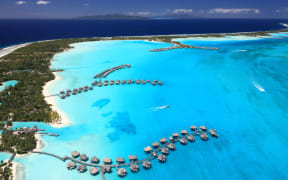 Over water bungalows in Bora Bora Lagoon, French Polynesia.