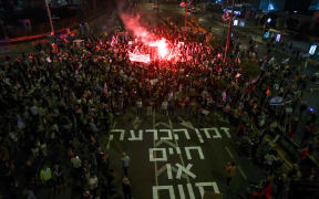 Protesters gather during a large rally in Tel Aviv held by the relatives and supporters of hostages against the Prime Minister Benjamin Netanyahu's government.