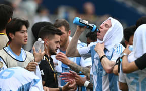 Ulsan Hyundai FC players take a drink during a cooling break as part of the FIFA Club World Cup 2025.
