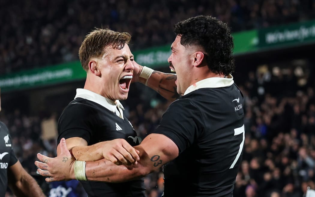 Du’Plessis Kirifi celebrates with Ruben Love.