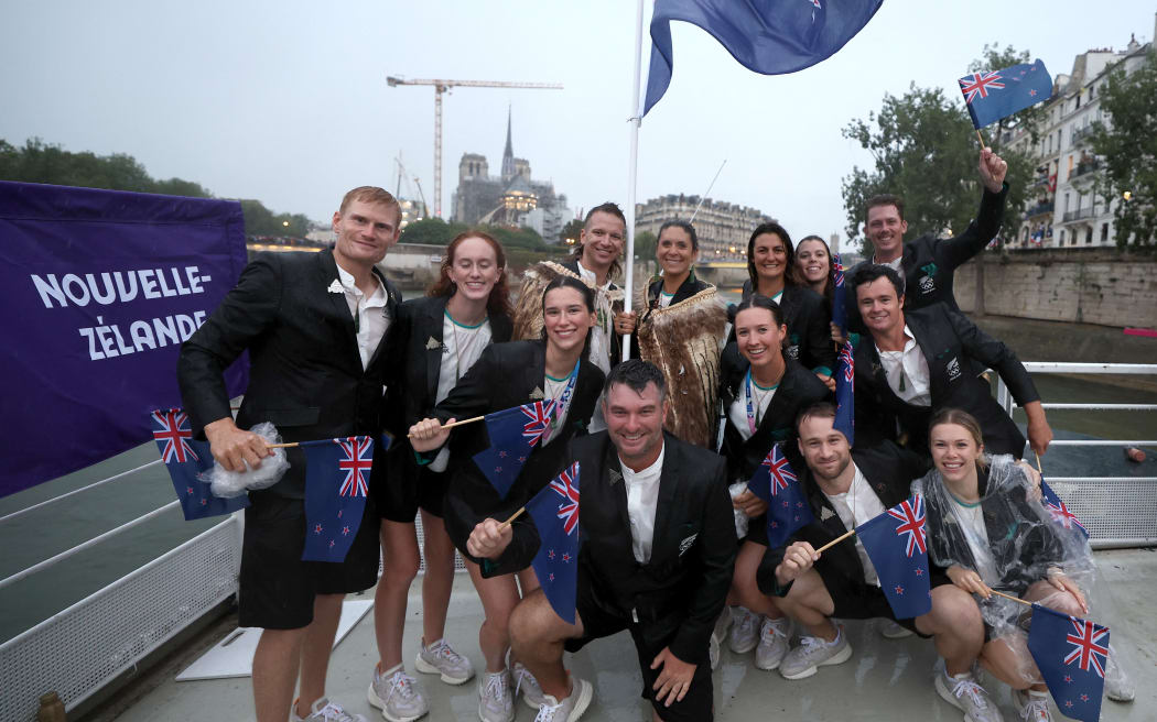 PARIS, FRANCE - JULY 26: Athletes of Team New Zealand pose for a photo as they cruise along the River Siene during the opening ceremony of the Olympic Games Paris 2024 on July 26, 2024 in Paris, France. (Photo by Hannah Peters / POOL / AFP)