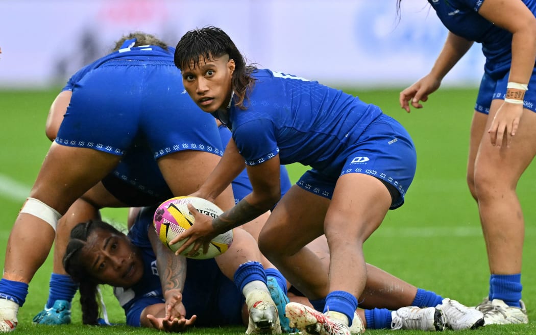 Samoa's scrum half Ana-Maria Afuie passes the ball during the Women’s Rugby World Cup pool A match between England and Samoa at Franklin's Gardens, Northampton, central England, on August 30, 2025. (Photo by Glyn KIRK / AFP)