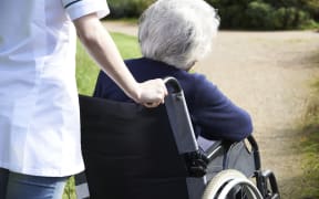 Senior woman in wheelchair.