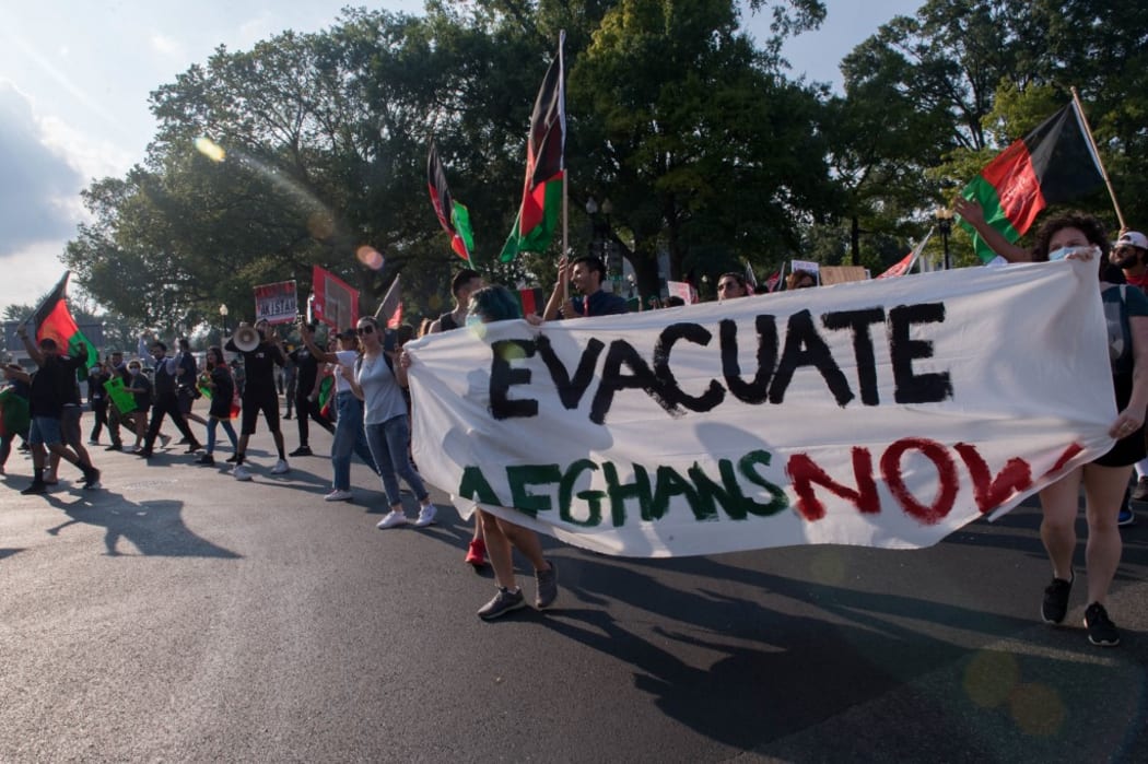 Demonstrators from the "Save Afghan Lives" protest chant as they march towards the U.S. Capitol shutting down Constitution Ave on August 28, 2021 in Washington, DC.