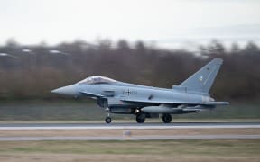 (FILES) In this file photo taken on February 26, 2024 an Eurofighter jet of the TacticalAir Force Wing 74 of the German Armed Forces starts to the NATO-Mission Air Policing Baltikum from the Airbase in Neuburg at the Donau, southern Germany. Germany said on September 11, 2025 it would expand its role in a NATO mission to defend Polish airspace, a day after drones from Russia flew across the border into Poland.
The chancellery said Berlin would "extend and expand" its participation in the alliance's Air Policing programme. The German defence ministry said it would double the number of Eurofighter jets deployed to four and extend their mission by three months to the end of the year. (Photo by LUKAS BARTH-TUTTAS / AFP)