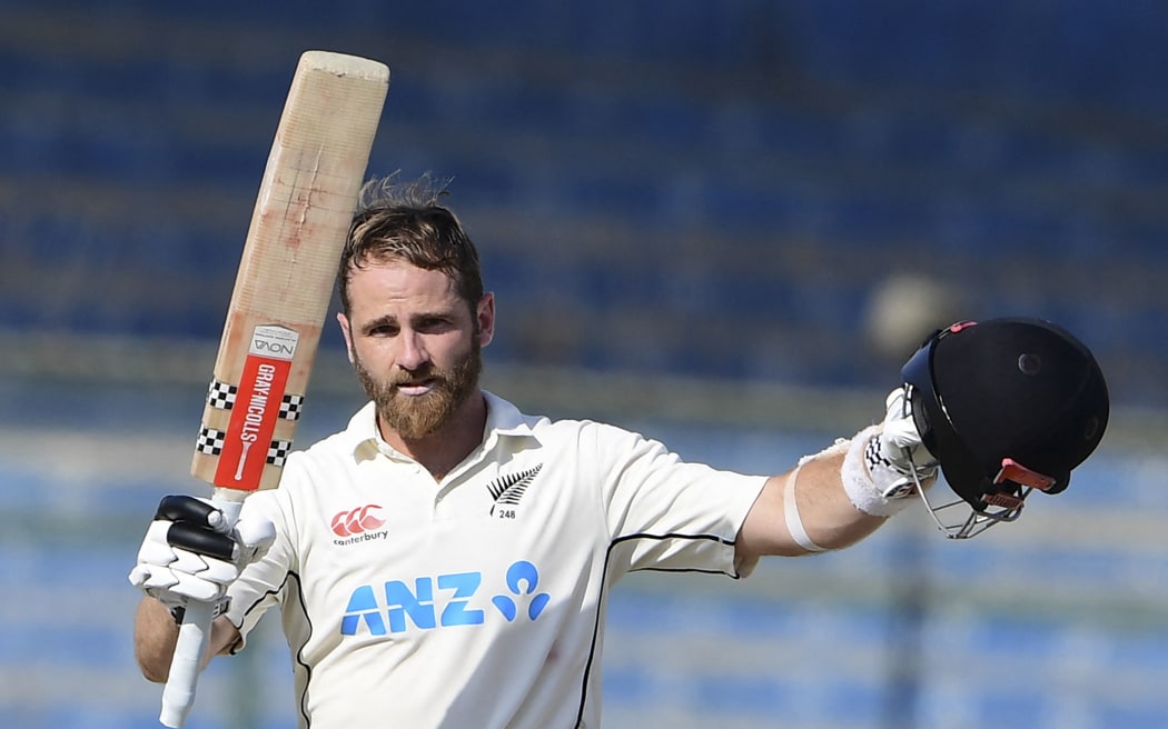 New Zealand's Kane Williamson celebrates scoring a double century against Pakistan in Karachi, 2022.