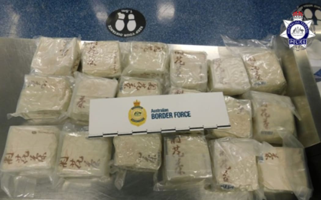 A New Zealander is accused of trying to import 38 kilograms of methamphetamine into Australia by hiding it under some towels in suitcases.