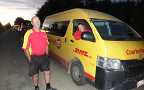 CourierPost driver Debbie Boyd (in van) and contractor Lloyd Granger wait in the queue for Takaka.