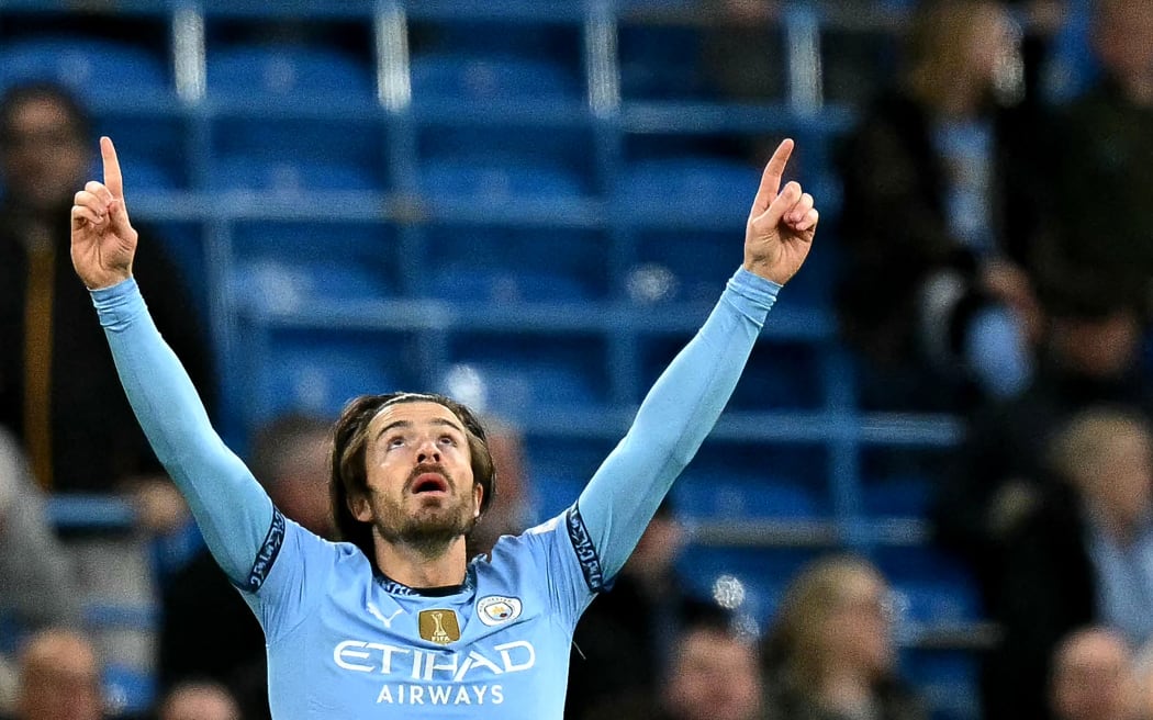 Jack Grealish salutes to the sky after scoring Manchester City's first goal in their 2-0 Premier League win over Everton at Etihad Stadium in Manchester, 2 April, 2025.