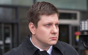 Chicago police officer Jason Van Dyke leaves the Criminal Courts Building after pleading not guilty to first-degree murder charges.