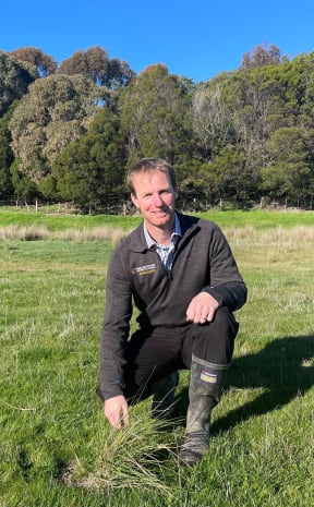 Marlborough District Council biosecurity manager Liam Falconer with an example of Chilean needle grass at the Wither Hills Farm Park near Blenheim.