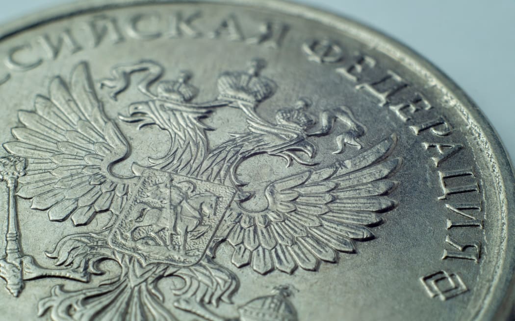 One Russian Ruble coin with double eagle.