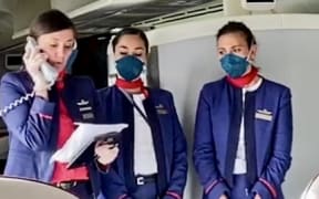 Latam cabin crew on repatriation flight to Rapa Nui or Easter Island.