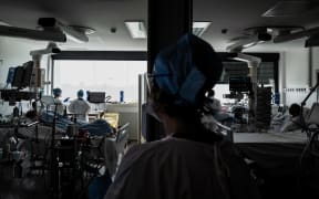 Doctors take care of Covid-19 patients in an intensive care unit of Lyon Croix-Rousse hospital.