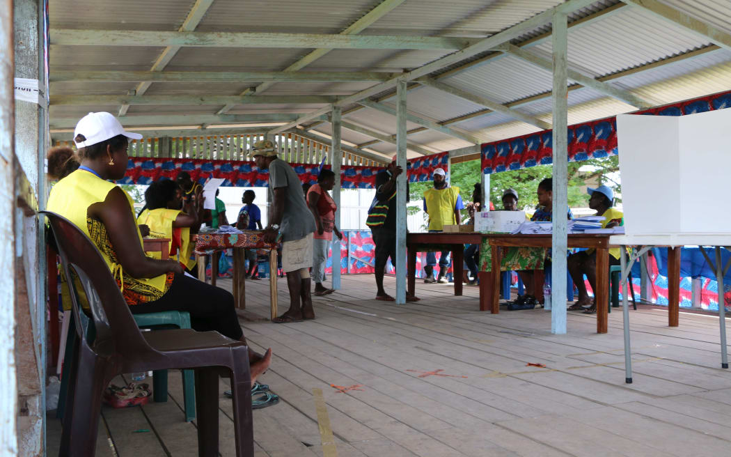 Voters file through a polling booth in Buka town to cast their vote for the Bougainville independence referendum.