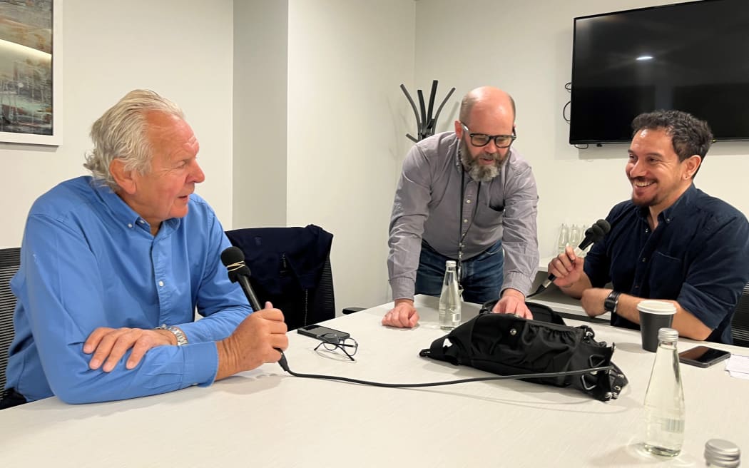 A photo of Bill Beaumont, Chairman of World Rugby, Fair Game Executive Producer, Justin Gregory, Fair Game Host, James Nokise. They are seated around a table and Bill Beaumont is beign interviewed.