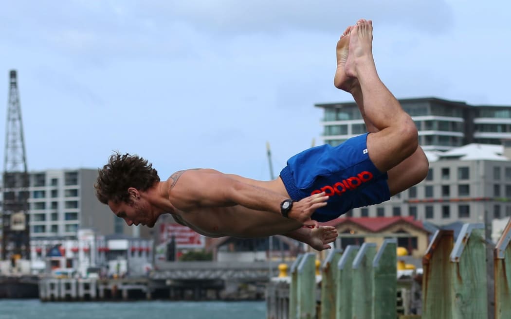 Gillies Kaka takes the plunge into Wellington Harbour.