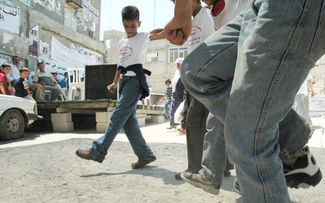 Palestinian boys practising the dabke