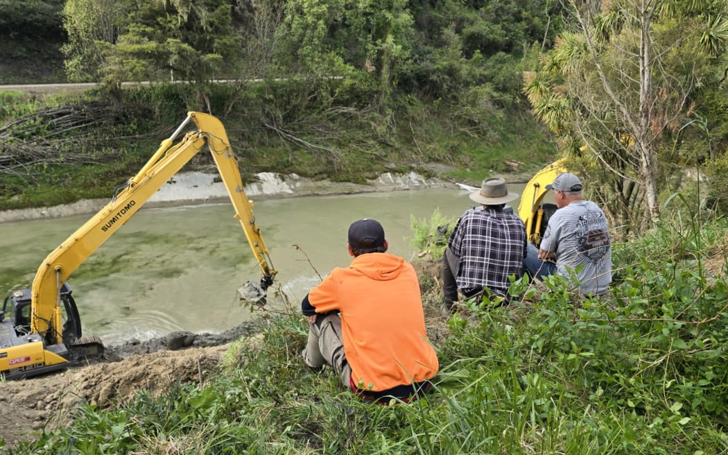 The demolition of the Burgess Bridge, which is not being funded for a rebuild. Pictured: Theo Grzeda (left), farmer Ian Burgess (centre) and Peter Ward (right) - the managing director of Ward Demolition.