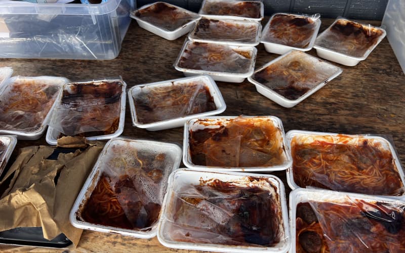 The pictures show the lunches the Whangarei school received with their packaging already coming off and burnt.