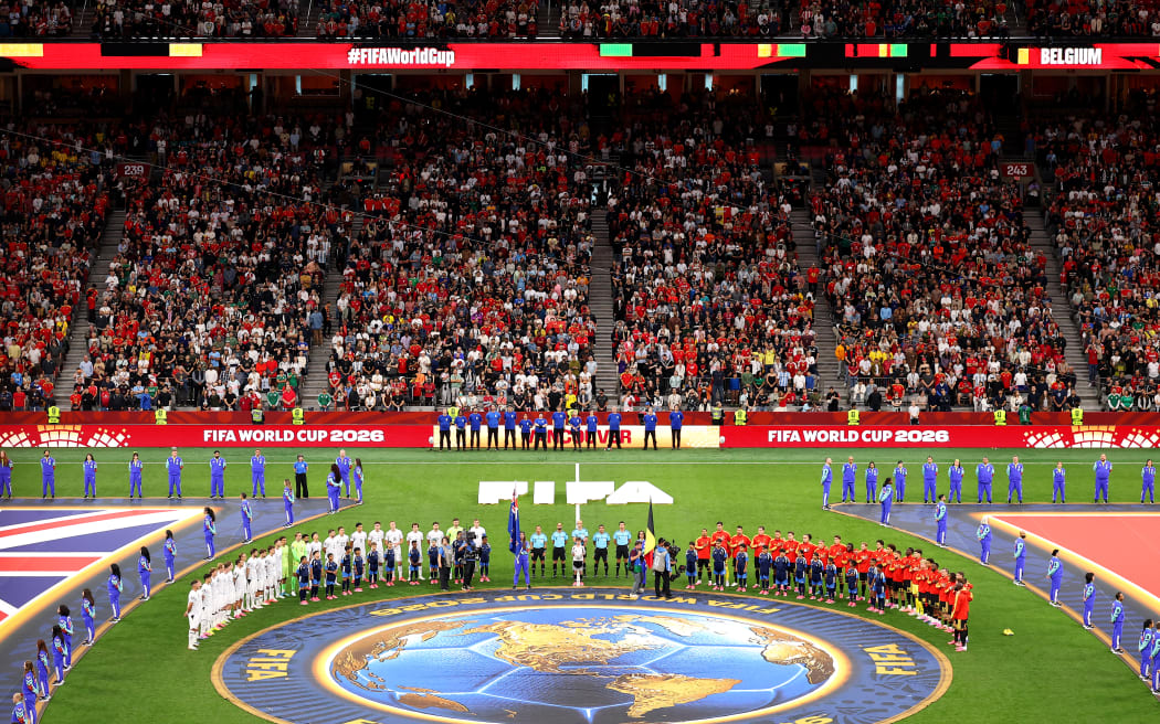 VANCOUVER, BRITISH COLUMBIA - JUNE 26: Players and officials stand for the national anthem before the FIFA World Cup 2026 Group G match between New Zealand and Belgium at BC Place Vancouver on June 26, 2026 in Vancouver, British Columbia.   Fran Santiago/Getty Images/AFP (Photo by Fran Santiago / GETTY IMAGES NORTH AMERICA / Getty Images via AFP)