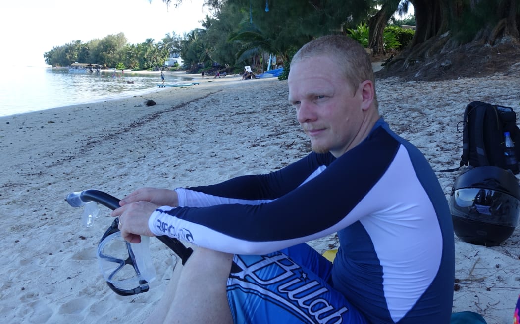 Tourist Hamish Whistler at Rarotonga's Muri lagoon, Cook Islands