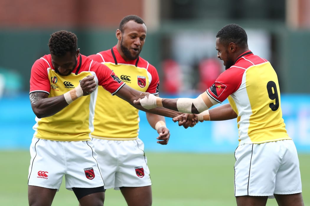 Papua New Guinea players celebrate a try against Jamaica.