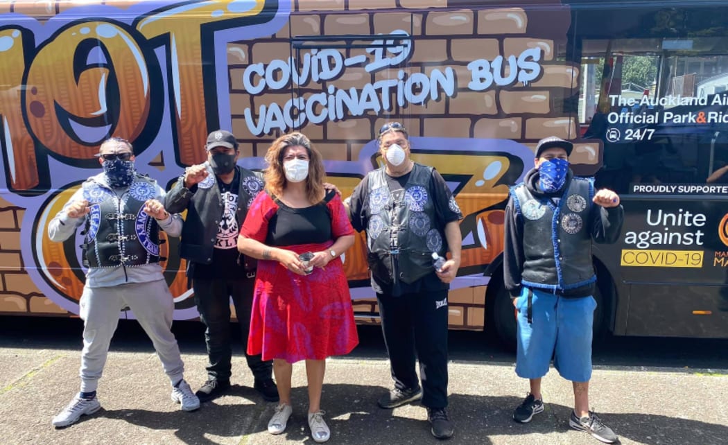 Auckland councillor Josephine Bartley, in red, at a mobile vaccination event.