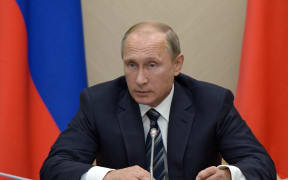 Russia's President Vladimir Putin chairs a meeting with members of the government at the Novo-Ogaryovo residence outside Moscow yesterday.