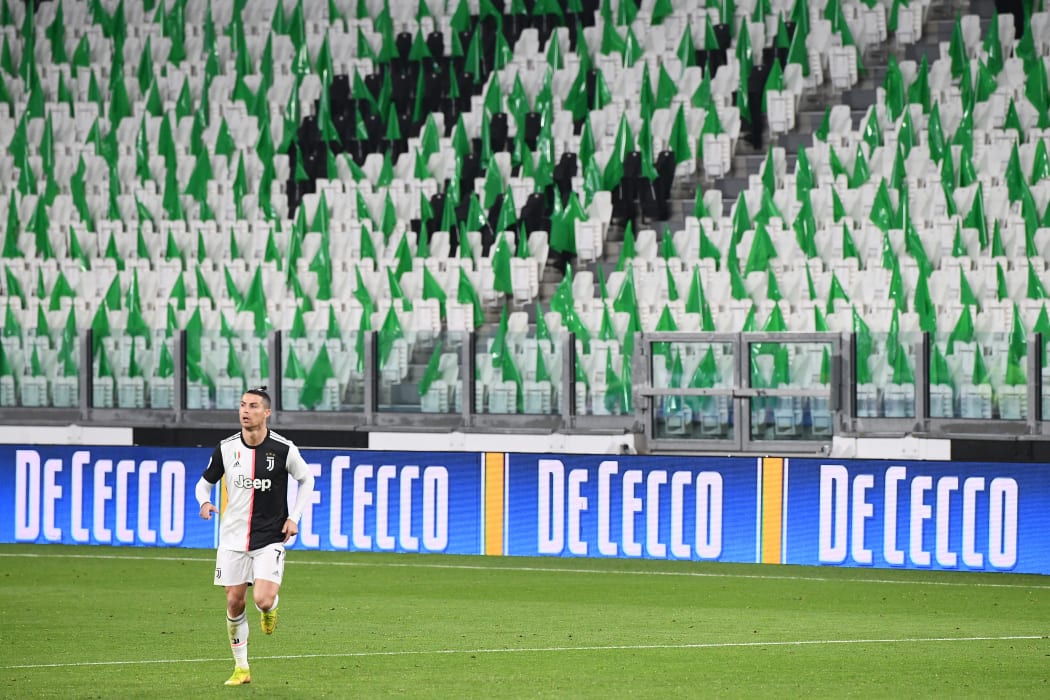 Juventus' Portuguese forward Cristiano Ronaldo runs on the pitch in an empty stadium during the Italian Serie A football match Juventus vs Inter Milan, at the Juventus stadium in Turin on March 8, 2020.