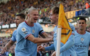 Jack Grealish of Manchester City celebrates with team mate Erling Haaland