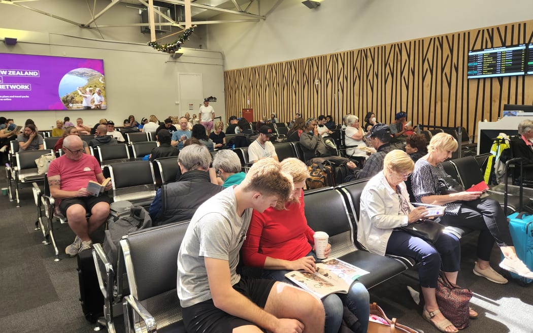 Travellers at Auckland Airport.