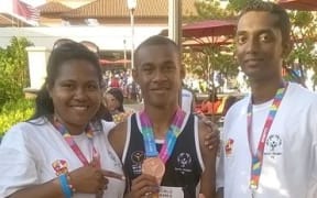 Special Olympian Sikeli Nakoivalu and his coaching staff.