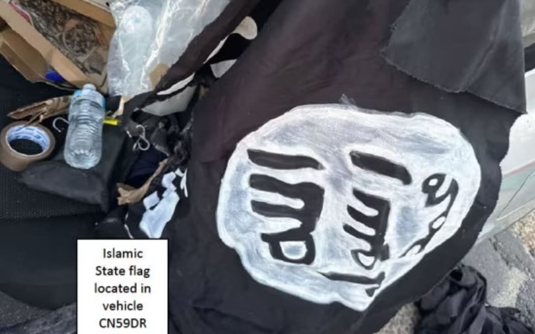 A homemade Islamic State flag sits in the back of the car driven by the Bondi gunmen.