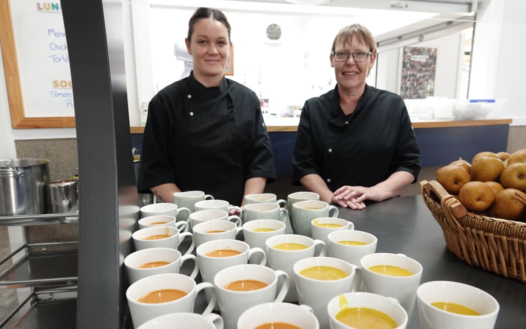 Kandice Speers, left, and Jacqui Peck stand ready to serve soup to students for morning tea on Wednesday.