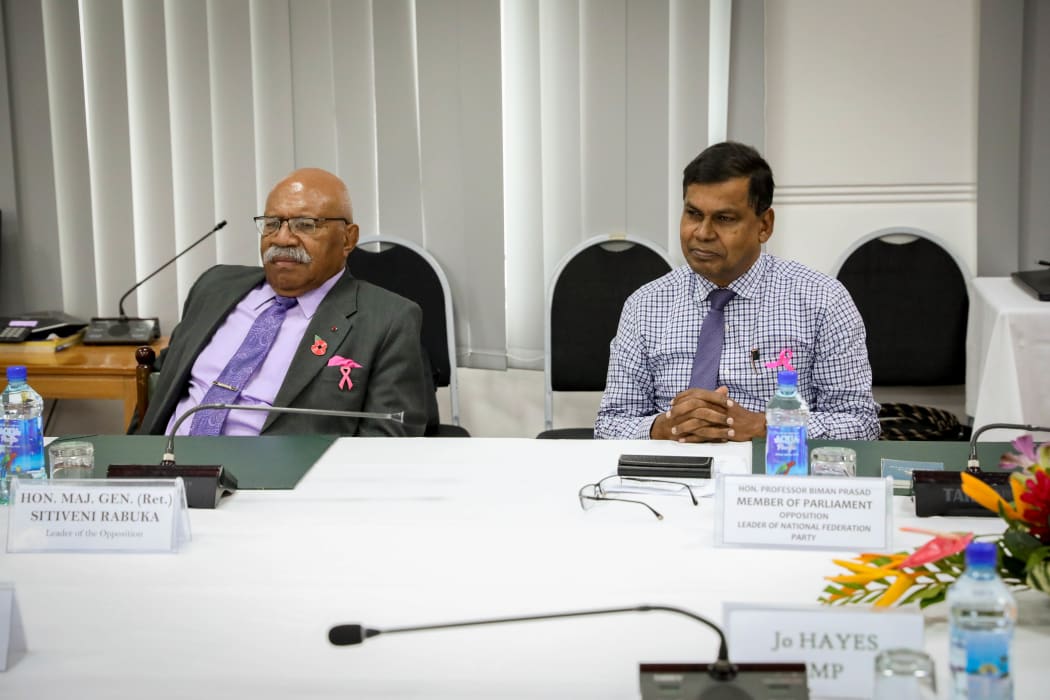Sitiveni Rabuka (left) and the leader of the National Federation Party Biman Prasad.