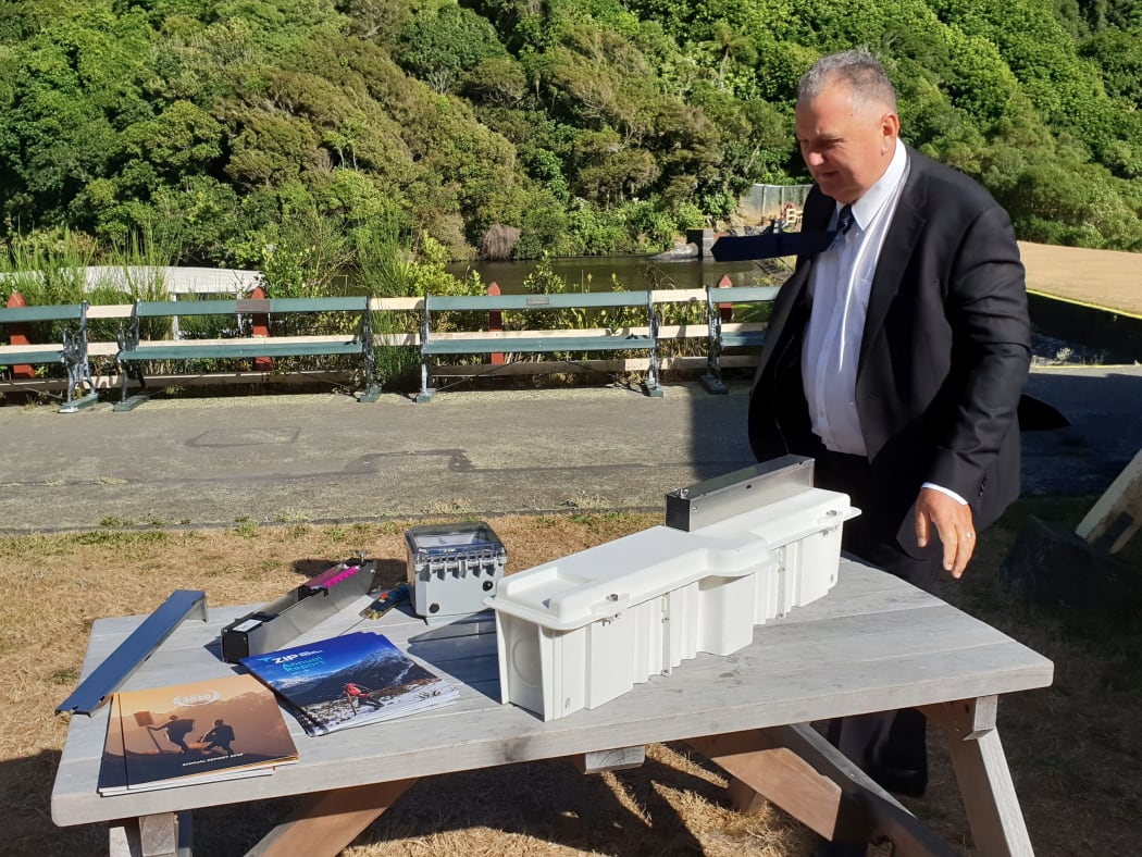 Regional Economic Development Minister Shane Jones inspects a new trap design.