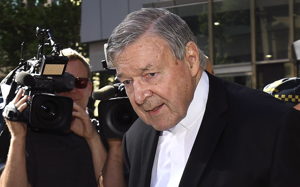 Cardinal George Pell walks to a car in Melbourne on December 11, 2018