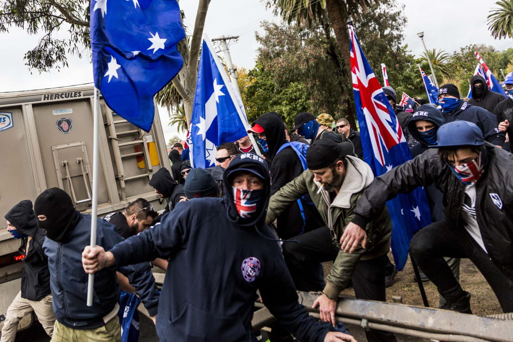 Protestors wear face masks during a 'Say No To Racism' protest in Coburg, Melbourne last year.