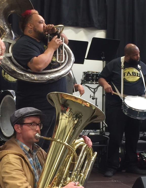 Free Agents' John Cannon (sousaphone) and Floyd Green (snare drum) with Wellington tuba player Dan Yeabsley at workshop
