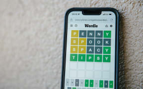 A mobile phone with the Wordle app