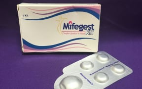 (FILES) In this file photo taken on May 8, 2020 courtesy of Plan C shows a combination pack of mifepristone (L) and misoprostol tablets, two medicines used together, also called the abortion pill. - A conservative federal judge in the state of Texas halted US approval of the abortion pill mifepristone on Friday, but paused implementation for a week to give federal authorities time to appeal. (Photo by Handout / PLAN C / AFP) / RESTRICTED TO EDITORIAL USE - MANDATORY CREDIT "AFP PHOTO / Elisa Wells / PLAN C" - NO MARKETING NO ADVERTISING CAMPAIGNS - DISTRIBUTED AS A SERVICE TO CLIENTS