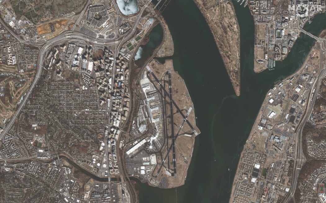 This satellite image on 30 January, 2025, of the crash area near Ronald Reagan Washington National Airport and the Potomac River one day after American Airlines flight 5342 collided with a US Army helicopter as the passenger jet approached the runway to land.