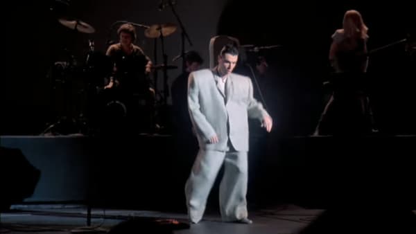 still image from the Talking Heads film 'Stop Making Sense': David Byrne dancing in his "big suit".