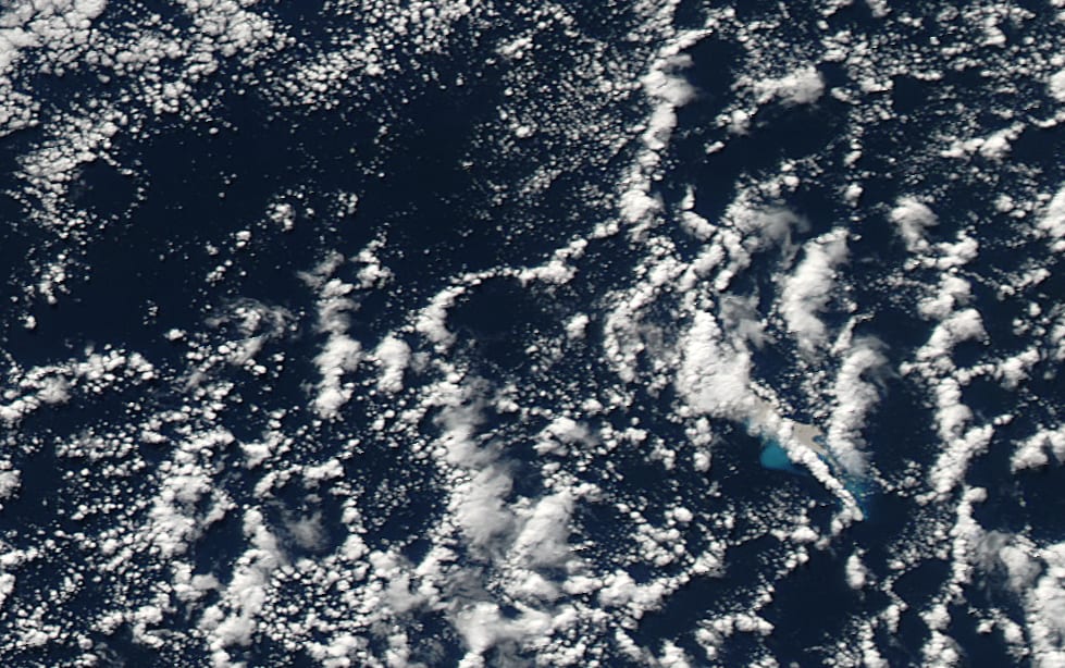 The pumice, plume and ash stained water can be seen in the satellite image.