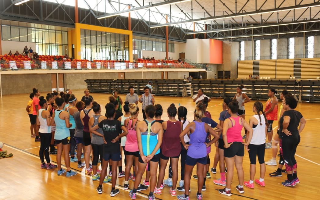 PNG Under 21 triallists listen intently to PNG Netball president Ulato Avei.
